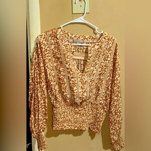 This is a floral dressy blouse with long sleeve